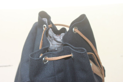 潮流与实用并存 韩版NIGBANG加厚帆布翻盖束口背包全解析